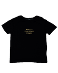 Black t-shirt with gold text on a white background