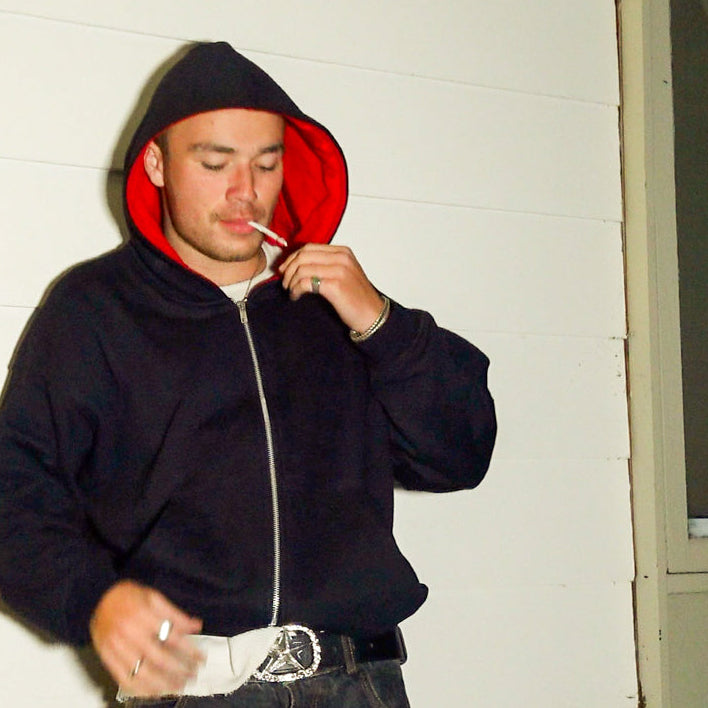 Dark hoodie with red liner inside. Heavyweight bomber