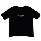 Black t-shirt with 'MOTHER fucker' printed in gold on a white background